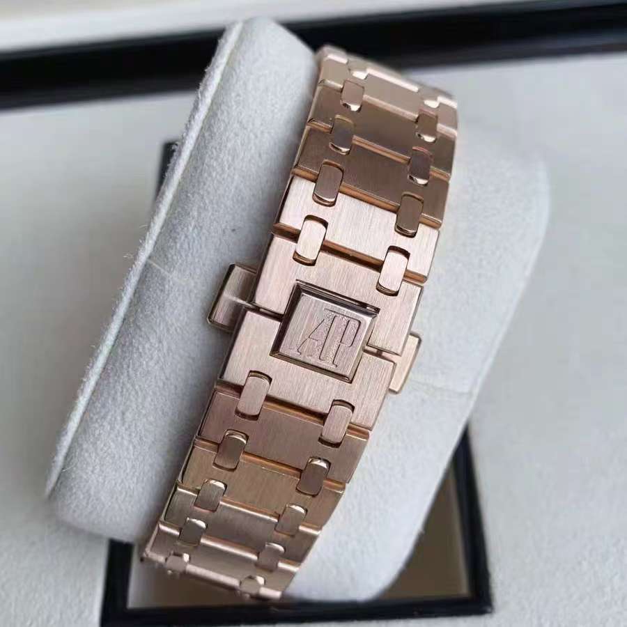 55 Audemars Piguet rose gold with white dial, automatic mechanical transparent back, 41mm case diameter, 18k rose gold case